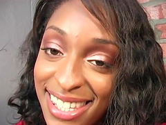 Ebony-skinned babe with an awesome body sucking a big white cock through a glory hole