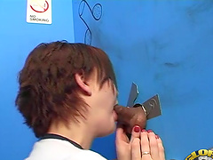 Short haired redhead takes a big black cock down her throat