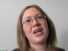 Brandy Dallas in glasses and thong sucking black cock through glory hole