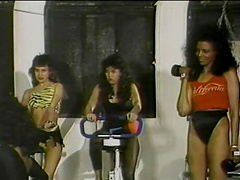 Erotic interracial brunettes in their pantyhose love flex in the gym in a retro action