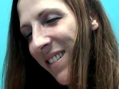 Brunette babe in sexy nurses' uniform and nylon stocking popping gum