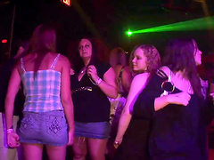 Slutty cowgirl in a thong strip teasing at a wild club party