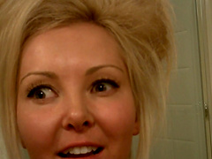 Sexy blonde solo model with long hair posing seductively in closeup shoot