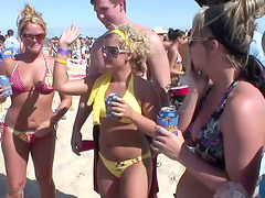 An outdoors beach party with pretty blondes in glasses