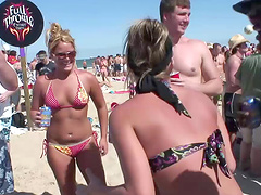 An outdoors beach party with pretty blondes in glasses