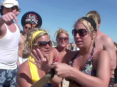 An outdoors beach party with pretty blondes in glasses