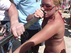 An outdoors beach party with pretty blondes in glasses