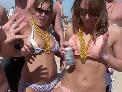 An outdoors beach party with pretty blondes in glasses