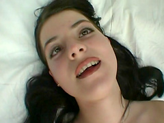 Solo brunette in long hair findle her big natural tits as she fingers her shaved pussy