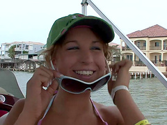 Sexy babe with nice tits fingering her pussy on the yacht