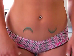 Sexy babe in her shorts shows off her ass and tits