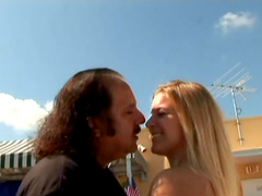 Gleaming blonde fingering her natural tits while fingering her shaved pussy outdoors