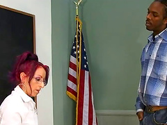 Redhead slut takes cumshot after being bonked cowgirl style by a big black cock