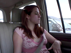 Seductive solo model with long hair masturbating in the car in a close up shoot