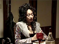 Perfect curly hair and dark lipstick on busty brunette beauty