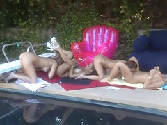 Kinky lesbian girls getting down and nasty out by the pool