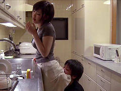 After a hot blowjob an Asian girl takes a cumshot in her mouth