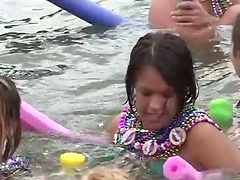 Bikini-clad babe with big tits dancing and having fun on a yacht