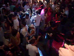 Pretty brunette with a hot body flashing her breasts in a club