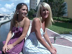 Two depraved chicks flash their butts and tits outdoors