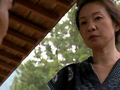 Mature Asian woman with big boobs enjoying a hardcore doggy style fuck