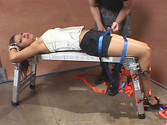 Gorgeous Asian submissive gets strapped to a bench by her Master