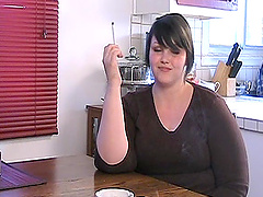 Chubby solo model flirts in the kitchen while enjoying a smoke