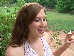 Hot brunette with small tits outside showing her boobs