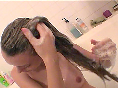 Brunette slut with small tits bathing and washing her long hair