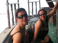 Brunette MILFs with big tits in lesbian porn showing off their tits