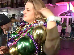 Randy slut flashing her nice tits at the mardi gras party