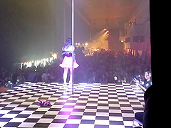 Ravishing punk cougar Joanna Angel strips on a stage