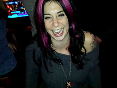 Ravishing punk cougar Joanna Angel strips on a stage