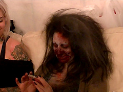 See hot girls get their zombie makeup in a behind the scenes video