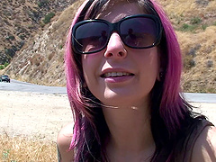 Sitting at a dusty rest stop Joanna Angel takes out her tits