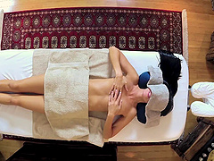 Masseur goes down on his client and fucks her shaved pussy