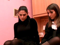 Girls in boots and pantyhose caress each other in a tease video