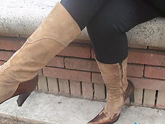 Chick slips out of her cowgirl boots to model her pretty feet