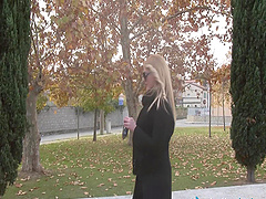 Blonde relaxes outdoors with a smoke and plays with her feet