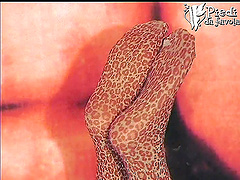 She relaxes on her bed and shows off her stocking covered feet