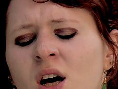 Solo model moans in pleasure as she treats herself with a lenghty dildo