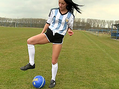 Hot soccer fun outdoors with a sporty and sexy brunette