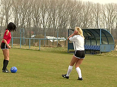 Soccer chicks in the grass finger fuck each other