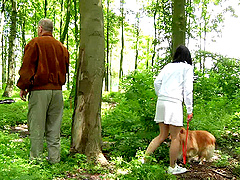 Girl walking her dog in the woods meets an old guy to fuck