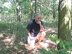 Mature guy with a stiff dick pleasured in the forest by Michaela Q