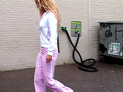 Curly-haired blondie Jennifer sucking a dick from a glory-hole