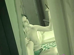 Hidden cam of  hot babe talking on the phone with no top on