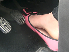 Petite brunette cowgirl shows off her sexy feet in the car