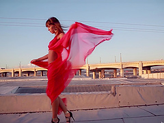 Beautiful chick dancing outdoors during sunset