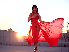 Beautiful chick dancing outdoors during sunset